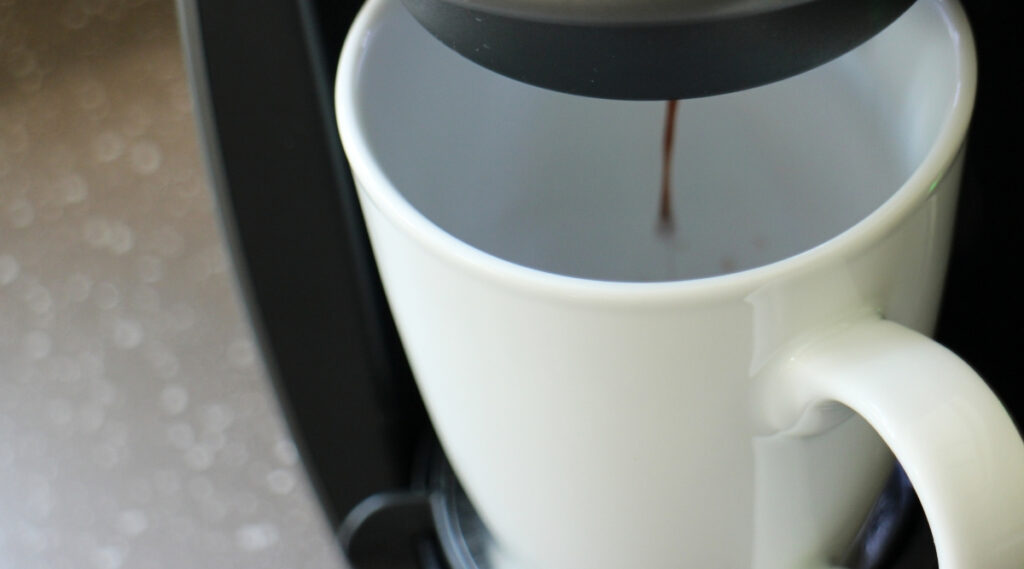 Keurig K Elite or K Elite C brewing coffee in a cup.