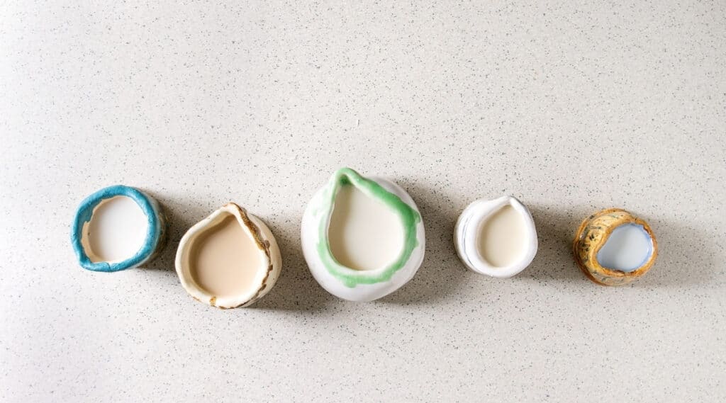 A variety of non dairy coffee creamers side by side.