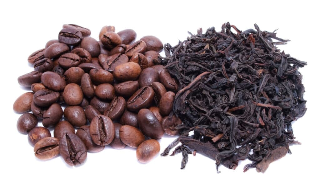 coffee beans and tea leaves side by side. 