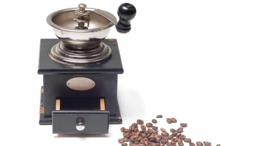 Coffee grinder grinding coffee beans. 