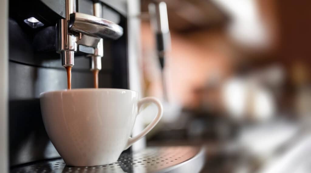 Automatic espresso machine brewing hot espresso.