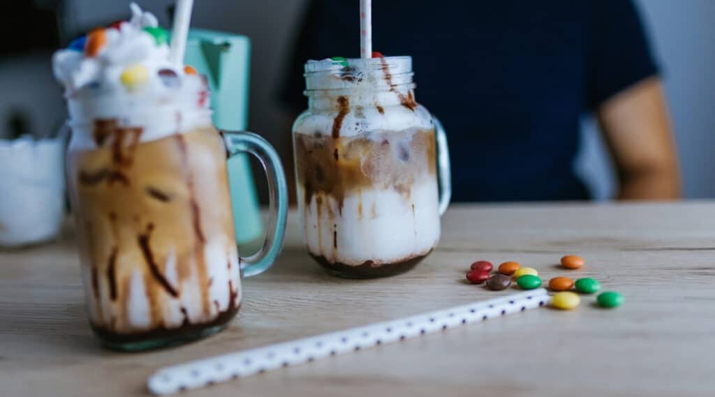 A cafe mocha next to a mocha latte.