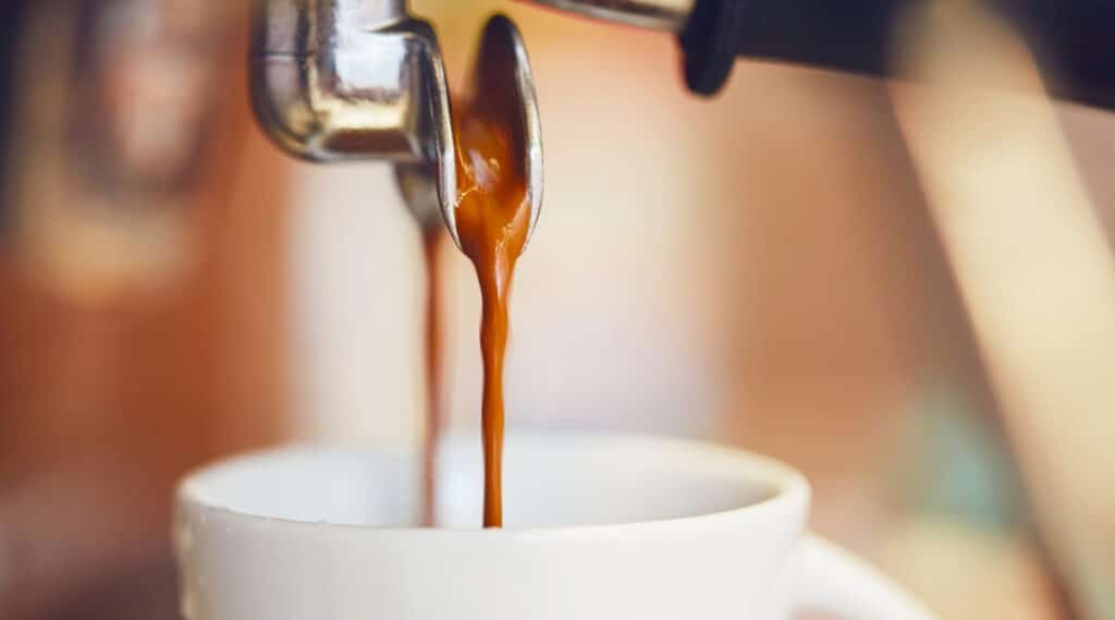 Nespresso Vertuo Next machine brewing thick espresso.